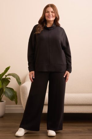 Techno Lux Drop Shoulder Funnel Neck Knit Top-Black